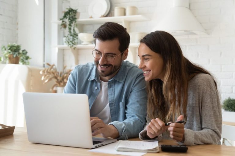 Couple looking at laptop together